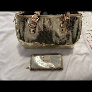 Michael Kors gold hand bag and matching wallet